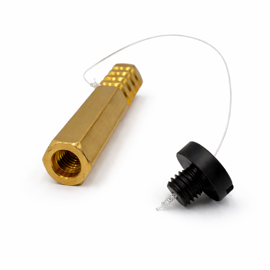 Tunnelbolt-anker i messing med plastskrue og snor som hindrer at skruen mistes i tunnelarbeid